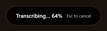 The indicator while transcribing: Transcribing… 64%, with the hint Esc to cancel